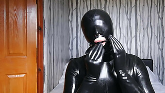 Latex Slave Blindfolded And Gagged In Bdsm