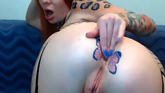 Butterfly Tattooed Beauty Gets Fisted On Webcam